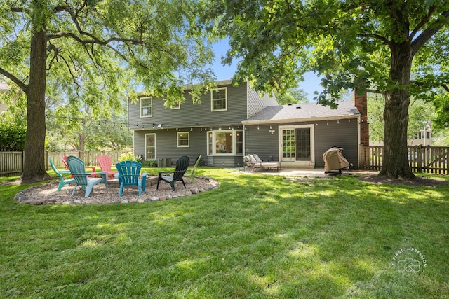 302 Carriage Hill Rd, Naperville, IL 60565 - rear view of property with a fenced backyard, a patio, an outdoor fire pit, and a chimney