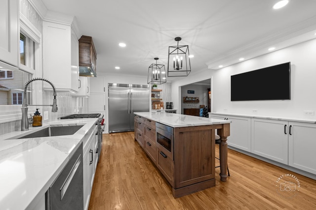 302 Carriage Hill Rd, Naperville, IL 60565 - kitchen featuring built in appliances, white cabinets, ornamental molding, light wood-style flooring, and recessed lighting