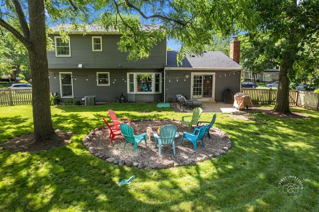 302 Carriage Hill Rd, Naperville, IL 60565 - rear view of house featuring a fenced backyard, a fire pit, a chimney, and a patio area