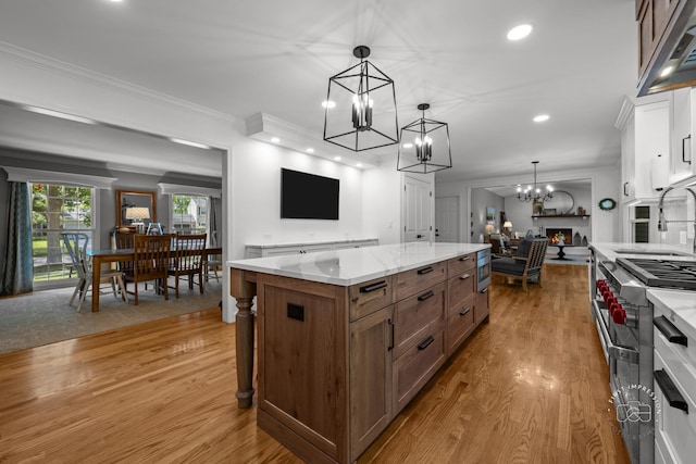 302 Carriage Hill Rd, Naperville, IL 60565 - kitchen with a chandelier, wood finished floors, open floor plan, crown molding, and pendant lighting