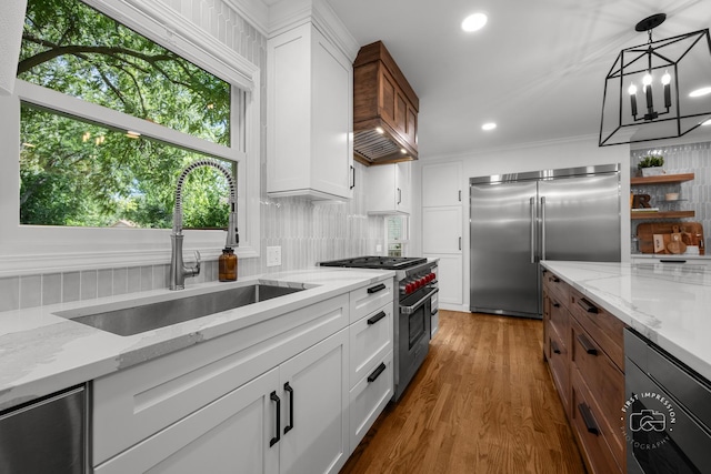 302 Carriage Hill Rd, Naperville, IL 60565 - kitchen with high end appliances, decorative backsplash, wood finished floors, recessed lighting, and white cabinets