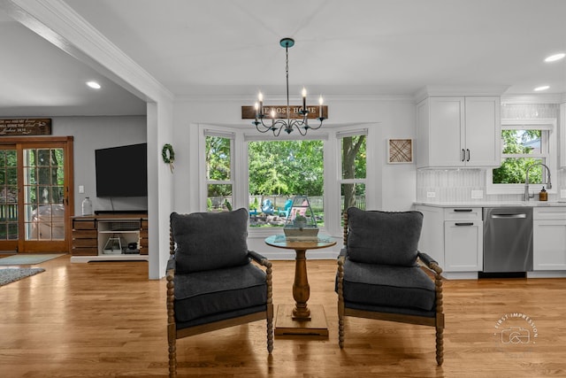 302 Carriage Hill Rd, Naperville, IL 60565 - living area with a chandelier, light wood-style flooring, plenty of natural light, recessed lighting, and ornamental molding