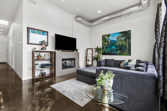 1375 N Milwaukee Ave Unit 3F, Chicago, IL 60622 - living room with a high ceiling, finished concrete flooring, recessed lighting, and a fireplace