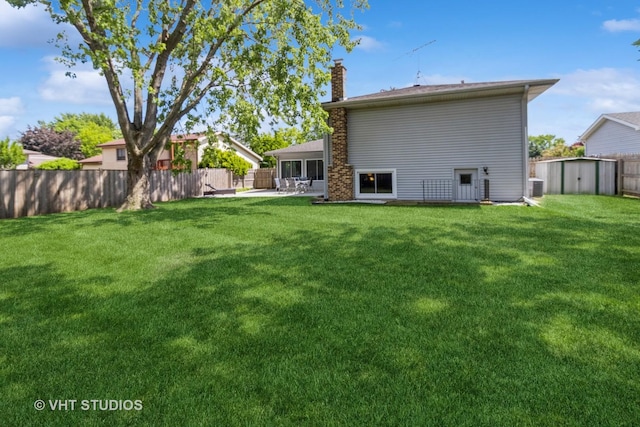 1942 Trail Ridge St, Arlington Heights, IL 60004 - back of house featuring a chimney, a storage shed, and a patio