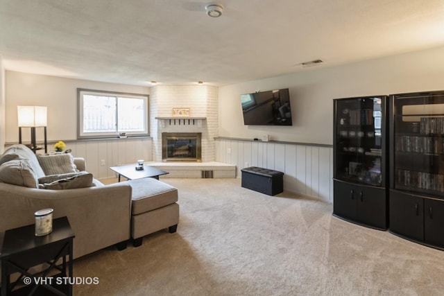 1942 Trail Ridge St, Arlington Heights, IL 60004 - living area featuring carpet floors, a fireplace, and a wainscoted wall