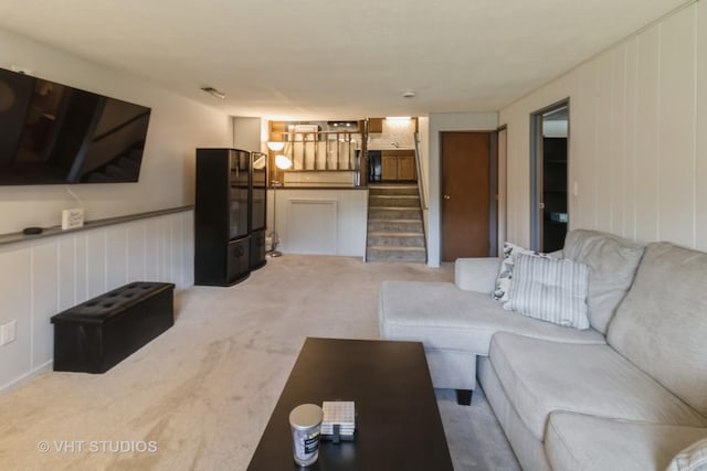 1942 Trail Ridge St, Arlington Heights, IL 60004 - living room with light colored carpet, stairs, and a decorative wall