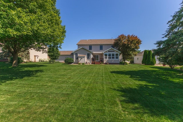 605 Ironwood Cc Dr, Normal, IL 61761 - back of property featuring a lawn and entry steps