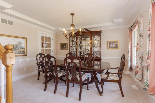 605 Ironwood Cc Dr, Normal, IL 61761 - dining room with a chandelier, light carpet, and crown molding