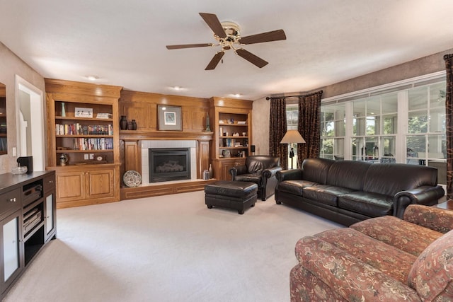605 Ironwood Cc Dr, Normal, IL 61761 - living room with carpet floors, a tiled fireplace, and ceiling fan
