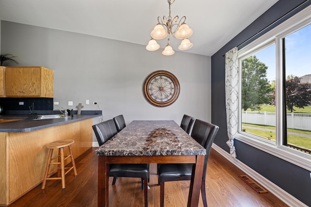 8331 W Chestnut Ct, Frankfort, IL 60423 - dining room featuring dark wood-type flooring and a chandelier
