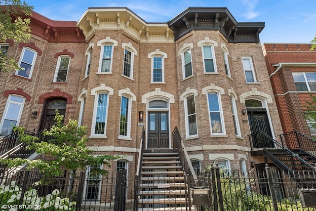2249 W Warren Blvd, Chicago, IL 60612 - italianate house with brick siding and a fenced front yard
