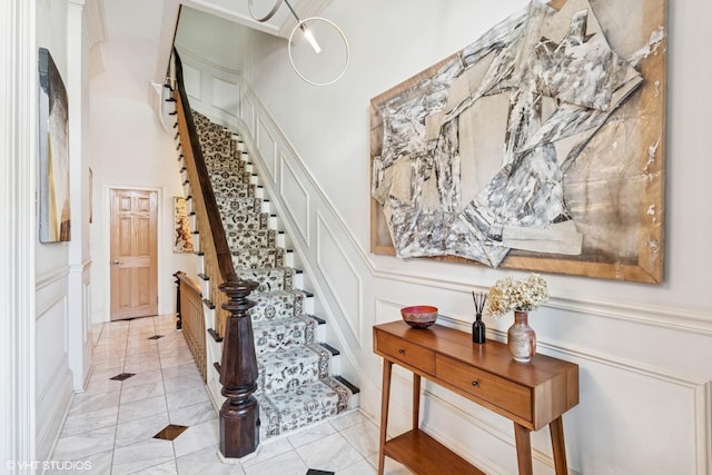 2249 W Warren Blvd, Chicago, IL 60612 - stairway with a decorative wall and a wainscoted wall