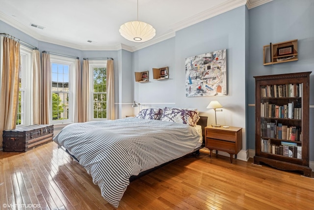 2249 W Warren Blvd, Chicago, IL 60612 - bedroom with hardwood / wood-style flooring and crown molding