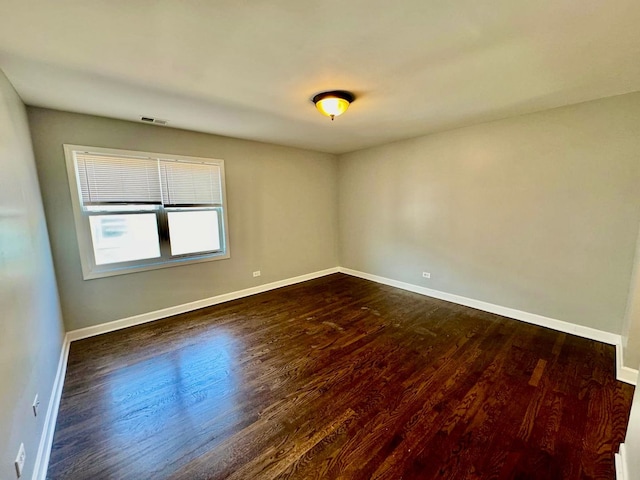 6433 N Damen Ave Unit 3E, Chicago, IL 60645 - spare room featuring dark wood finished floors