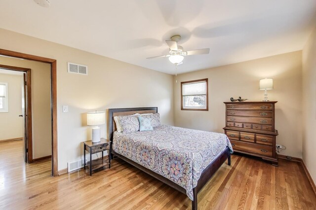 7203 W Lill St, Niles, IL 60714 - bedroom with light wood-style flooring and ceiling fan