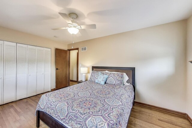 7203 W Lill St, Niles, IL 60714 - bedroom with wood finished floors, a closet, and a ceiling fan