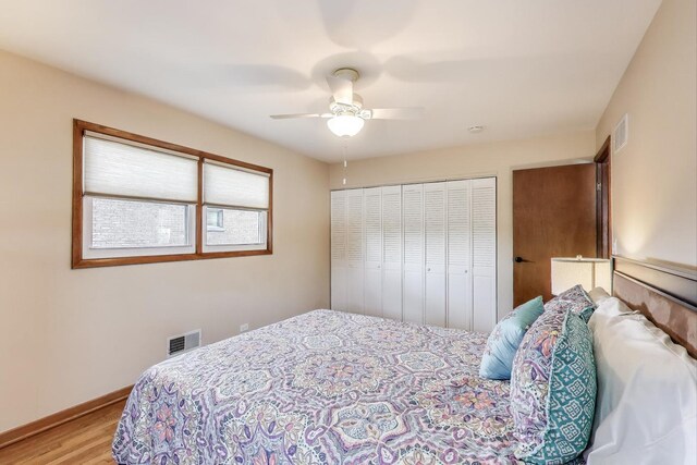 7203 W Lill St, Niles, IL 60714 - bedroom featuring wood finished floors, a closet, and a ceiling fan