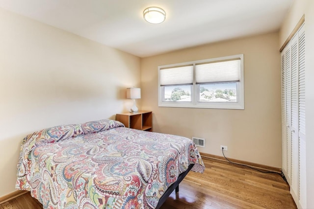 7203 W Lill St, Niles, IL 60714 - bedroom featuring wood finished floors and baseboards