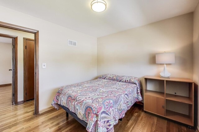 7203 W Lill St, Niles, IL 60714 - bedroom with wood finished floors and baseboards