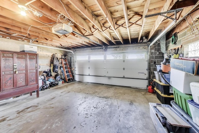 7203 W Lill St, Niles, IL 60714 - garage featuring a garage door opener