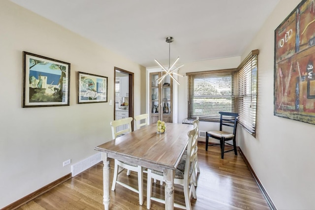7203 W Lill St, Niles, IL 60714 - dining room featuring wood finished floors and baseboards