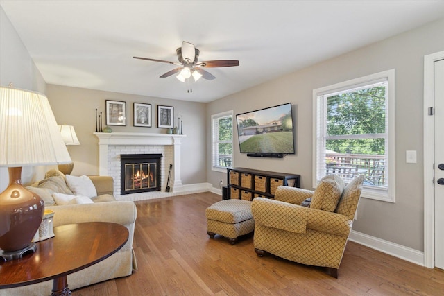 11740 Wagon Ln, Roscoe, IL 61073 - living room featuring ceiling fan, wood finished floors, and a fireplace
