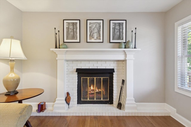 11740 Wagon Ln, Roscoe, IL 61073 - detailed view of wood finished floors and a brick fireplace