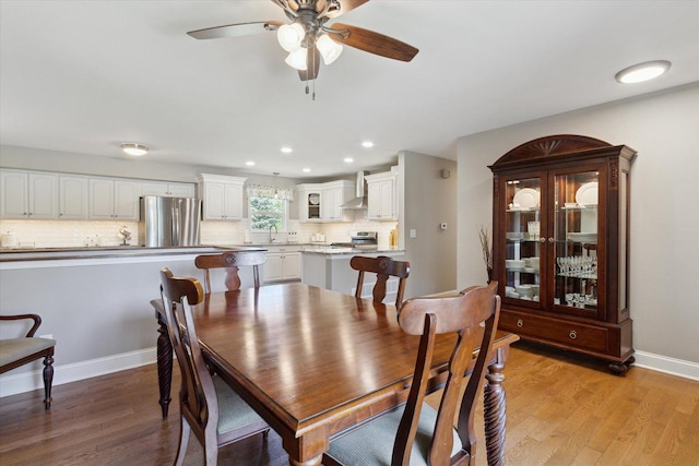 11740 Wagon Ln, Roscoe, IL 61073 - dining room with ceiling fan, light wood-style floors, and recessed lighting