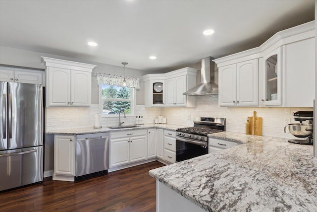 11740 Wagon Ln, Roscoe, IL 61073 - kitchen with appliances with stainless steel finishes, wall chimney exhaust hood, glass insert cabinets, light stone counters, and dark wood-style flooring