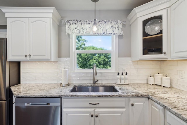 11740 Wagon Ln, Roscoe, IL 61073 - kitchen featuring glass insert cabinets, white cabinetry, appliances with stainless steel finishes, decorative backsplash, and light stone counters