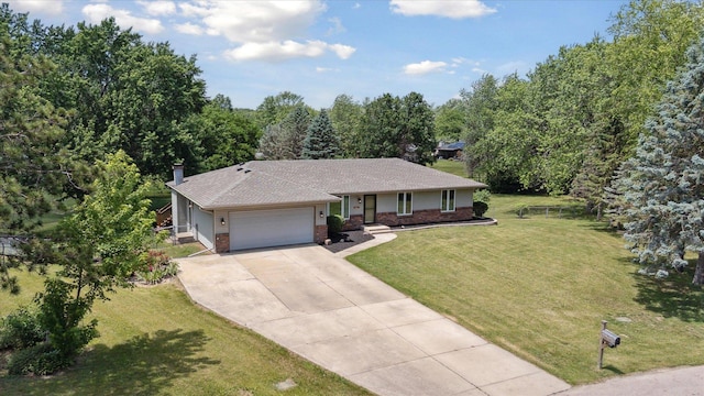 11740 Wagon Ln, Roscoe, IL 61073 - single story home featuring brick siding, concrete driveway, a garage, a front yard, and roof with shingles