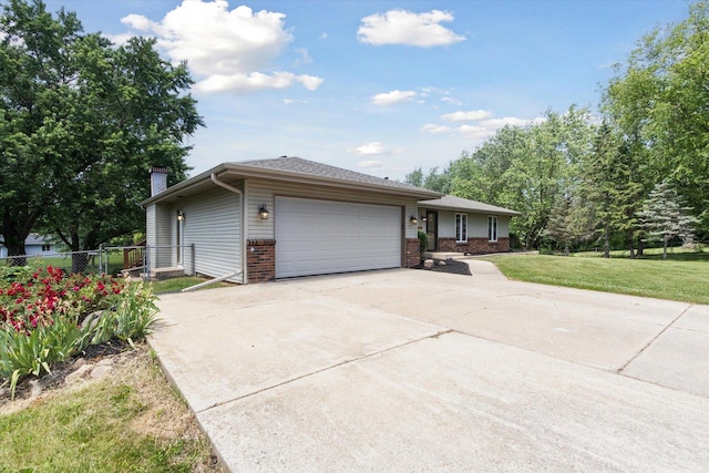 11740 Wagon Ln, Roscoe, IL 61073 - ranch-style house featuring brick siding, a garage, driveway, and a chimney