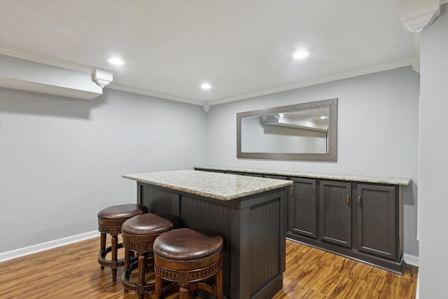 11740 Wagon Ln, Roscoe, IL 61073 - indoor dry bar featuring crown molding, wood finished floors, and recessed lighting