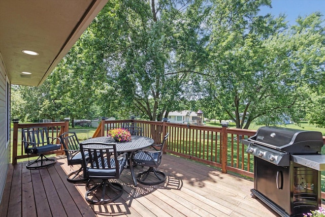 11740 Wagon Ln, Roscoe, IL 61073 - wooden deck with a grill, outdoor dining area, and a yard
