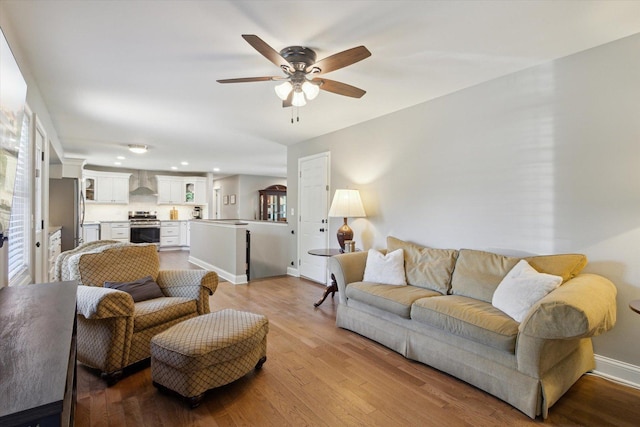 11740 Wagon Ln, Roscoe, IL 61073 - living room with wood finished floors, ceiling fan, and recessed lighting