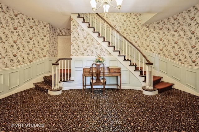 521 Coventry Ln Unit 3, Crystal Lake, IL 60014 - stairway featuring wallpapered walls, wainscoting, a chandelier, and a decorative wall