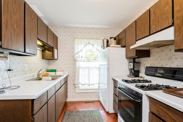 521 Coventry Ln Unit 3, Crystal Lake, IL 60014 - kitchen with range with gas stovetop, under cabinet range hood, light countertops, backsplash, and wallpapered walls