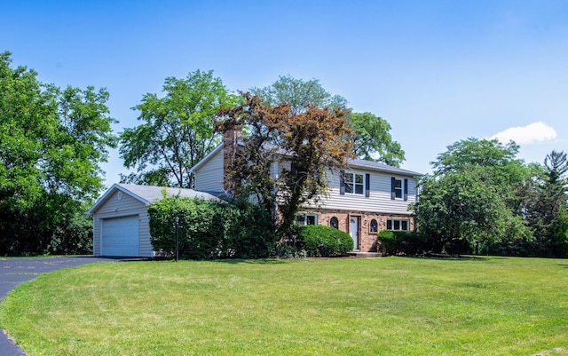22W046 Mccormick Ave, Glen Ellyn, IL 60137 - view of front of house featuring a front lawn, brick siding, a garage, and a chimney