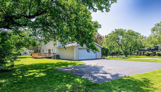 22W046 Mccormick Ave, Glen Ellyn, IL 60137 - view of side of property with a wooden deck, a yard, and a detached garage