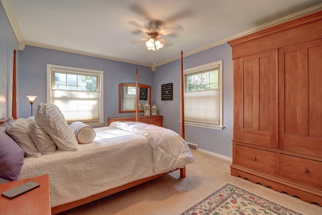 410 W 12th St, Sterling, IL 61081 - bedroom featuring light carpet, ornamental molding, and a ceiling fan