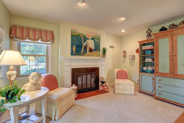 410 W 12th St, Sterling, IL 61081 - living area featuring a fireplace with flush hearth, carpet, and recessed lighting