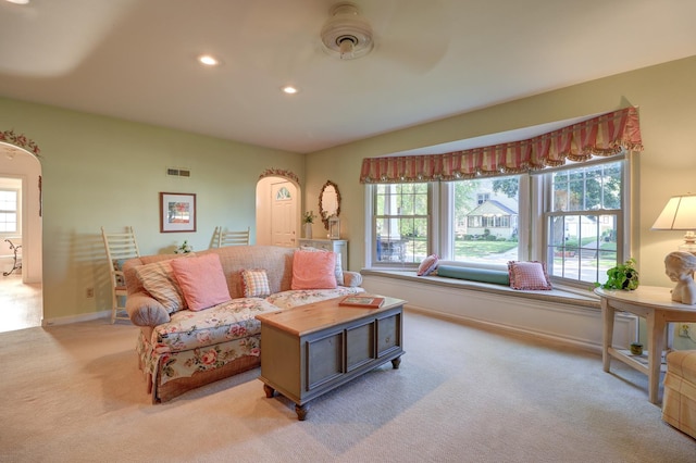 410 W 12th St, Sterling, IL 61081 - living room featuring light colored carpet, plenty of natural light, recessed lighting, and arched walkways