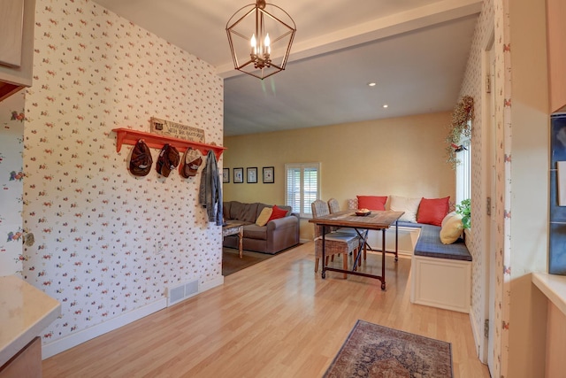 410 W 12th St, Sterling, IL 61081 - dining room featuring light wood-style flooring, wallpapered walls, a chandelier, and recessed lighting