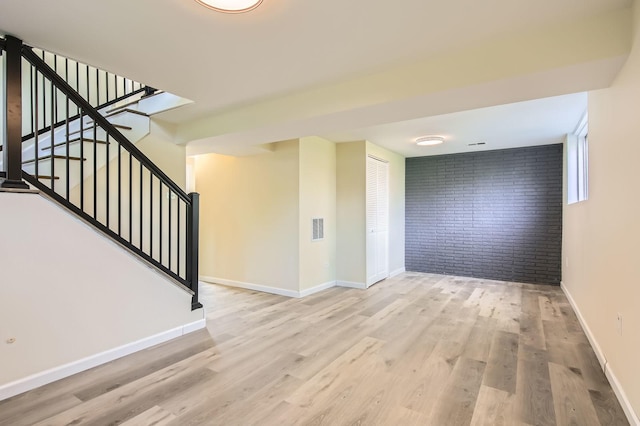 4723 Lee Ct, Richton Park, IL 60471 - empty room with brick wall, wood finished floors, and stairway