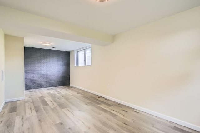 4723 Lee Ct, Richton Park, IL 60471 - empty room featuring brick wall and light wood-style floors