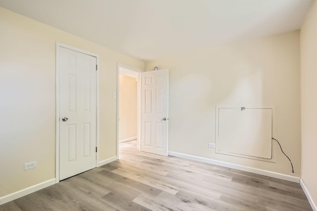4723 Lee Ct, Richton Park, IL 60471 - unfurnished bedroom with light wood-style floors and baseboards
