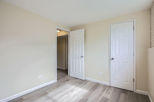 4723 Lee Ct, Richton Park, IL 60471 - unfurnished bedroom with light wood-style floors and baseboards