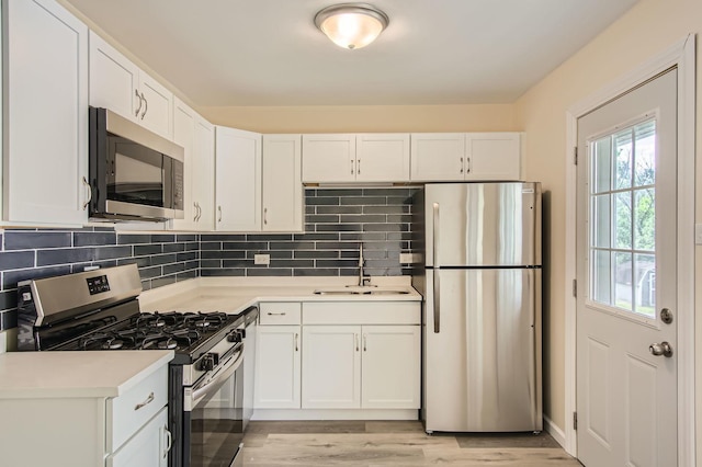 4723 Lee Ct, Richton Park, IL 60471 - kitchen featuring stainless steel appliances, light countertops, and white cabinets