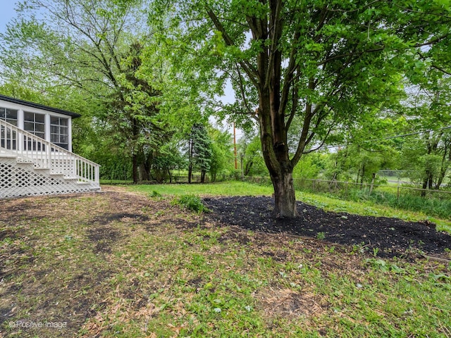 6950 Longmeadow Ln, Hanover Park, IL 60133 - view of yard featuring a sunroom