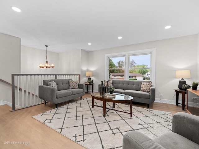 6950 Longmeadow Ln, Hanover Park, IL 60133 - living room featuring a chandelier, wood finished floors, and recessed lighting